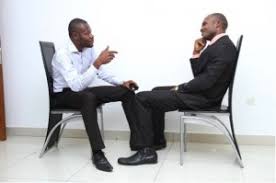 Two Men Having A Conversation